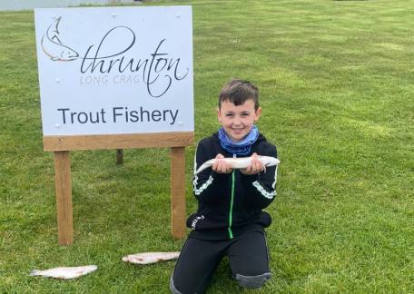 Max Conway with three fish from Crag End Bait Lake