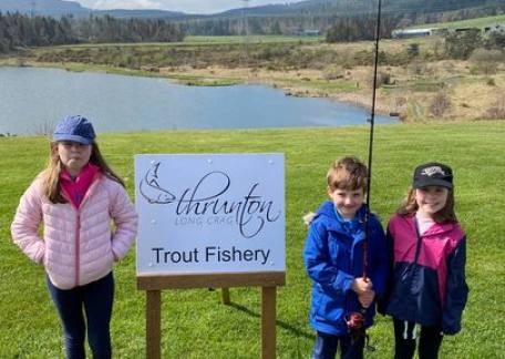 Smiles all round after a session on Crag End Bait Lake 