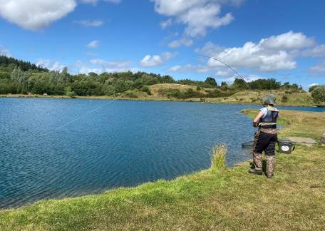 Alex Armer playing a fish during the Youth Troutmasters final 2022