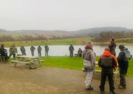 Anglers discussing tactics before the breifing