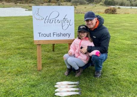 Issabel Dodd with four fish that she caught from Crag End Bait Lake 