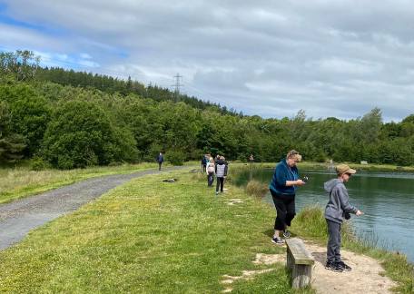 School children enjoying a nice day fly fishing 