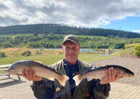 Paul Mallaburn with two nice Rainbows, with a combined weight of 7lb 