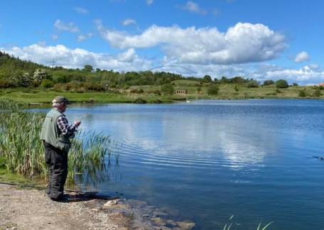 Ken Glenton getting a good fight from a Rainbow taken on a Nothing Fly