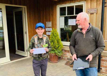 Sonny Kerr being presented with a Thrunton Fishing Voucher for his excellent performance 