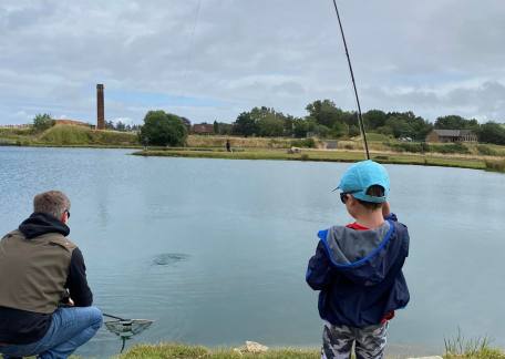 Fred Mather playing his first fish of the Junior session